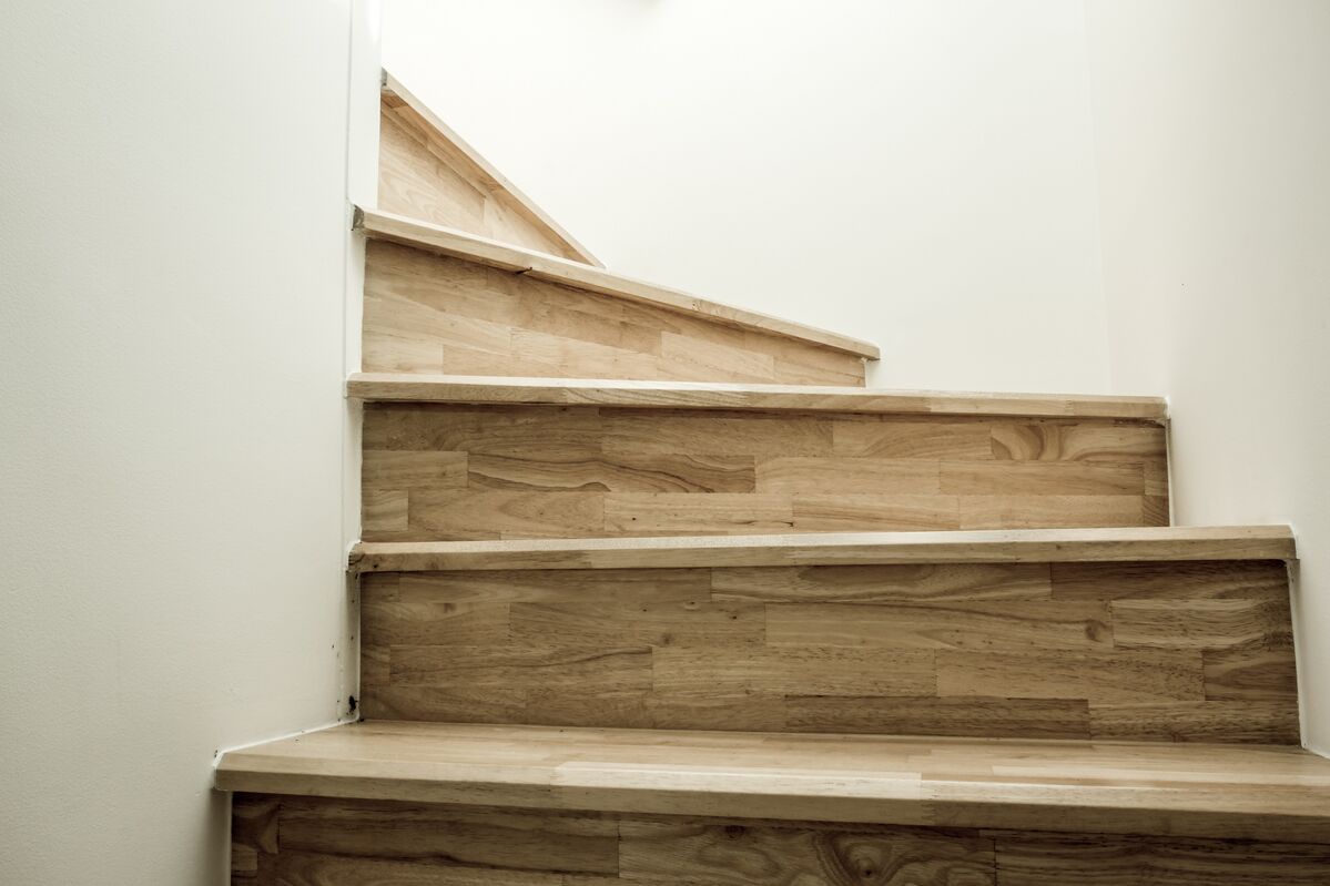 Wooden stairs in a home curving around a bend