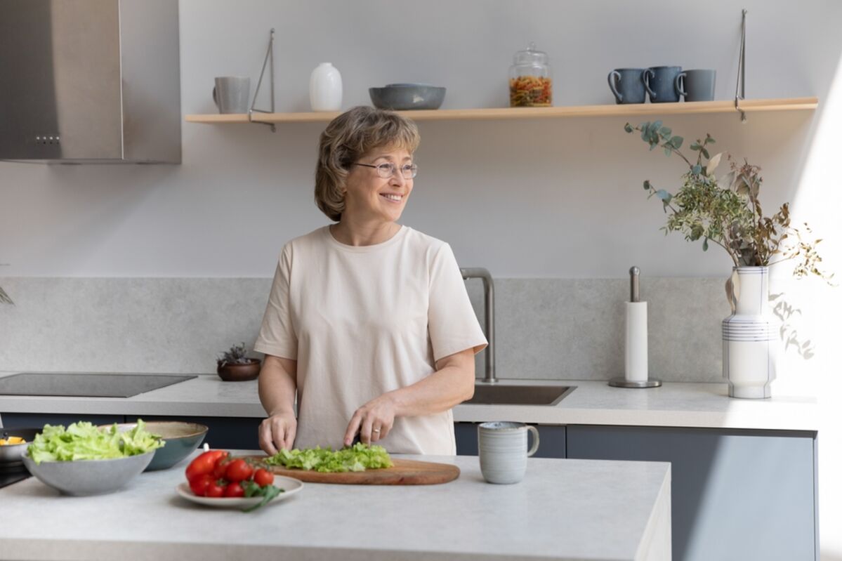 Lady smiling in the kitchen