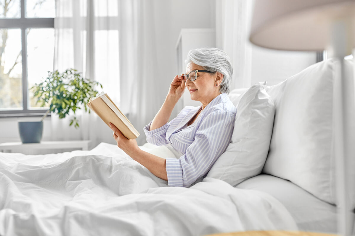 Lady reading in bed
